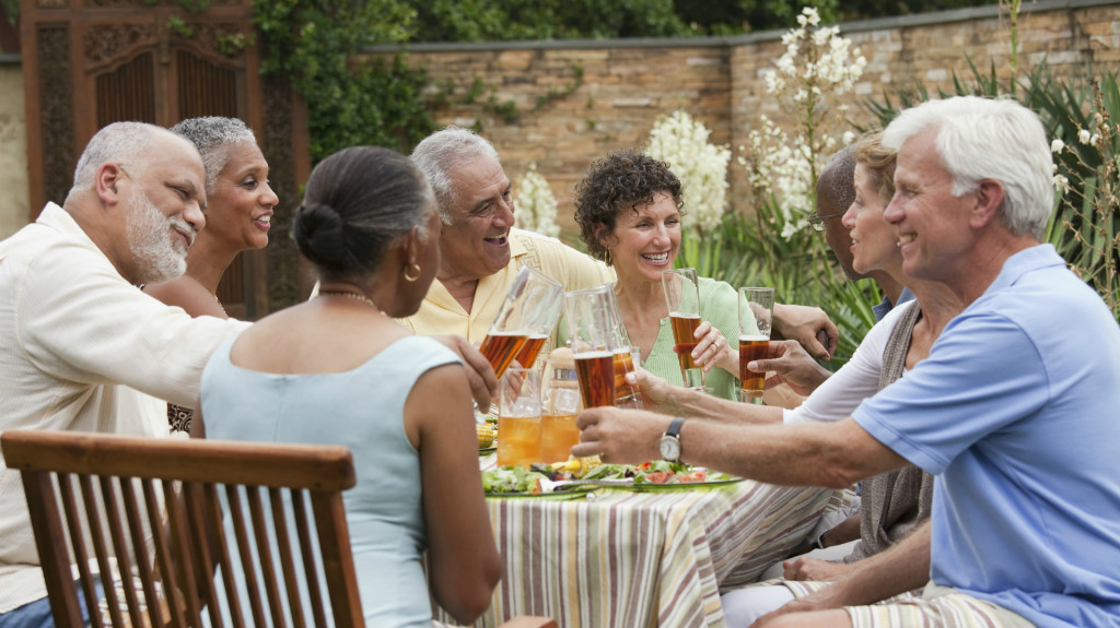 Active adults enjoying outdoor dinner party